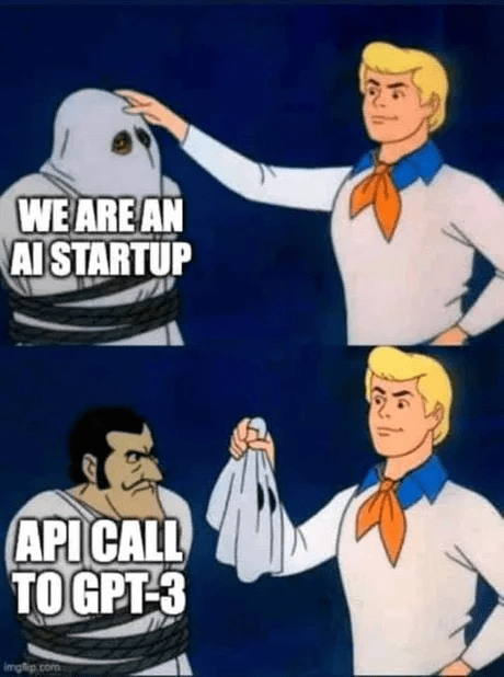 Scooby-Doo unmasking meme: a figure labeled 'we are an AI startup' is pulled off to reveal it was just an 'API call to GPT-3' underneath.